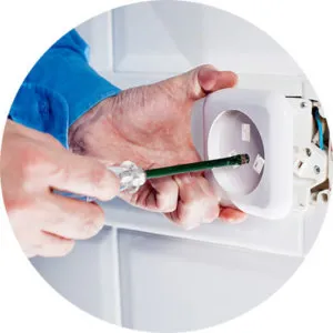 A maintenance man fixing an electrical plug in a rental property after a landlord received landlord advice from Slater and Brandley