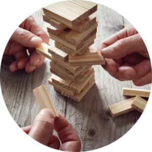 New tenants sat around playing jenga in their new rental property after the landlord recieved landlord advice